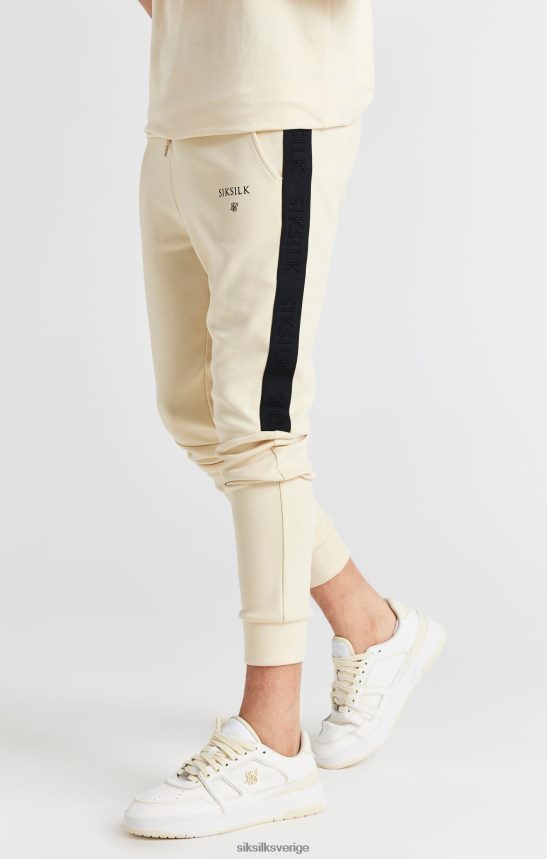 Pojkar SikSilk beige tejpad joggingbyxa kläder 02V424305