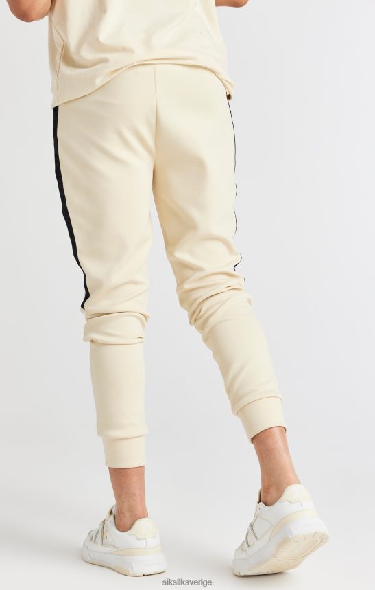 Pojkar SikSilk beige tejpad joggingbyxa kläder 02V424305