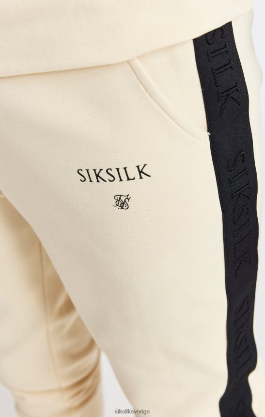 Pojkar SikSilk beige tejpad joggingbyxa kläder 02V424305