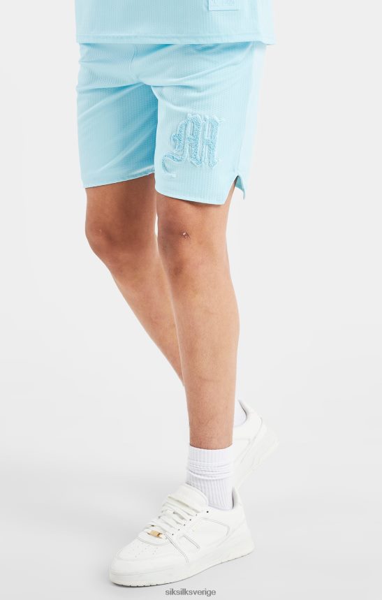Pojkar SikSilk x messi logo lös passform shorts - blå kläder 02V424313